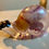 Thumbnail: Snail decoration with purple coloring and white rock