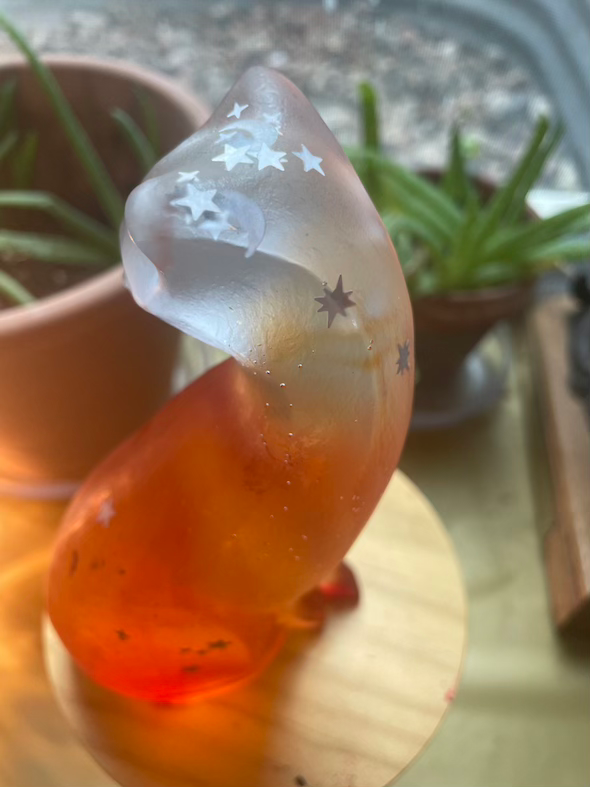 Thumbnail: Orange glass resin cat with silver moons and stars