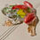 Thumbnail: Frog decoration with red ladybugs and dried flowers