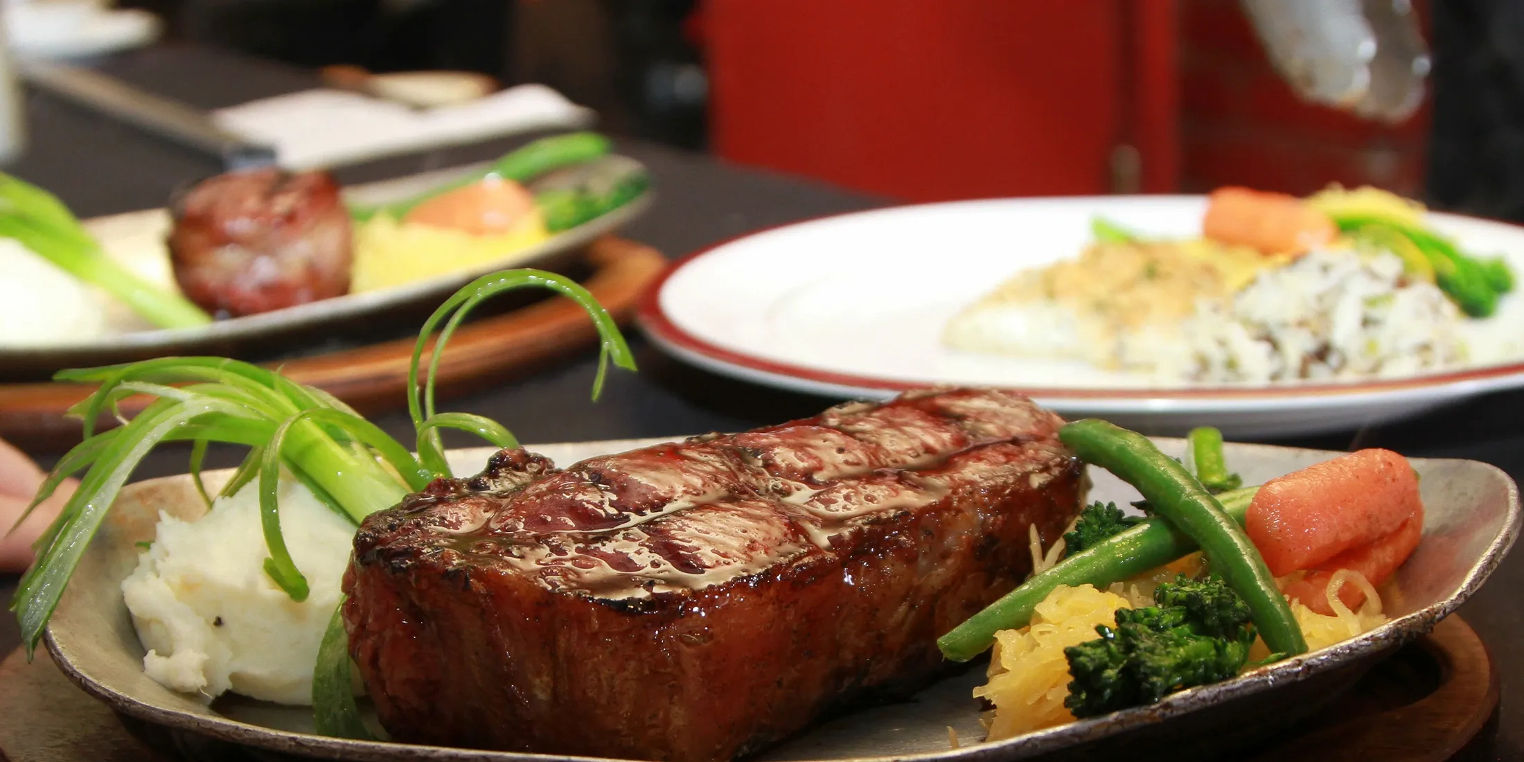 Steak, potatoes, and cooked vegetables from Antiquity Restaurant