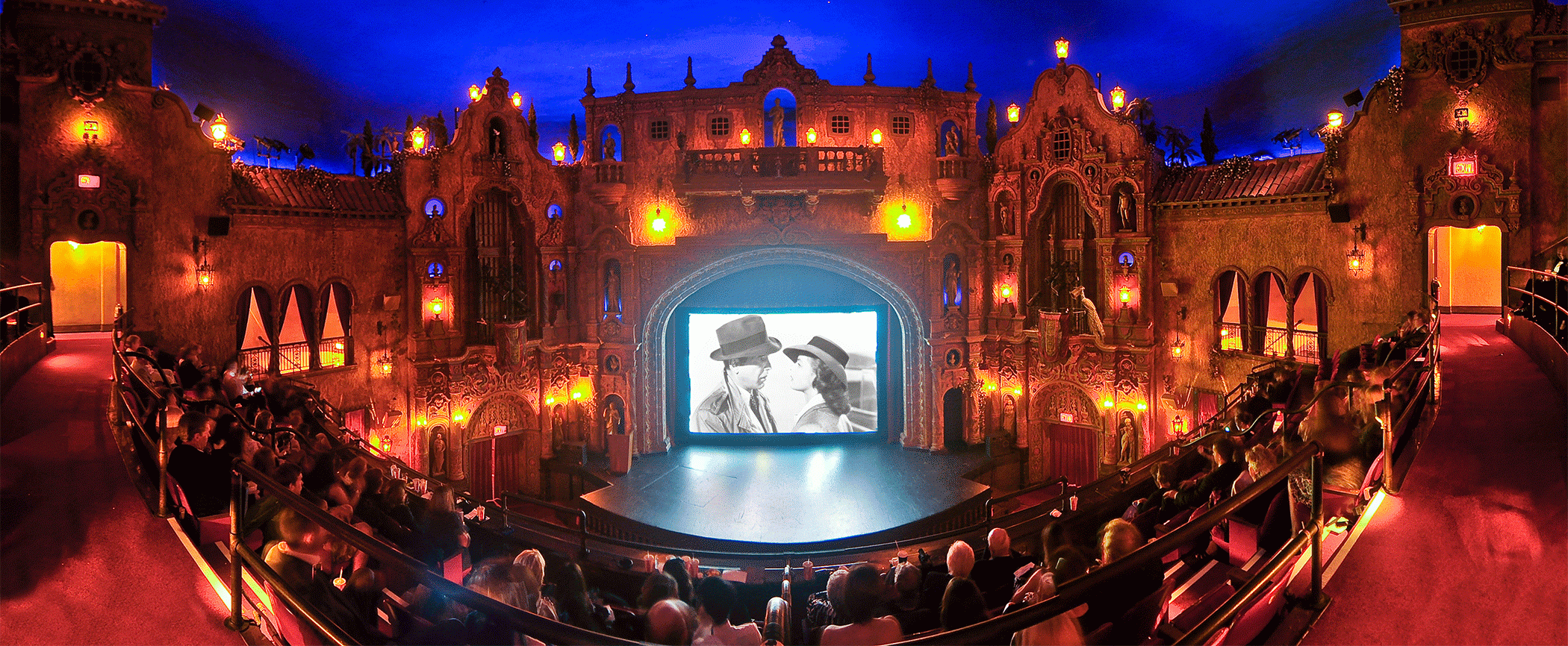 a fisheye camera view of the inside of tampa theatre showing an old film