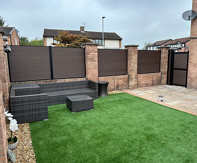 Mocha composite fencing and matching black-framed gates installed by DecKing in Culcheth.j