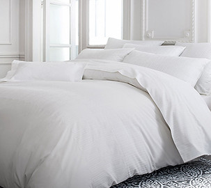 Luxury bed made with sumptuous crisp white linen