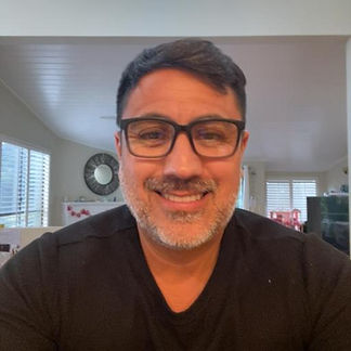 Original photo of a male with glasses before AI transformation, captured for an AI-generated photo booth experience.