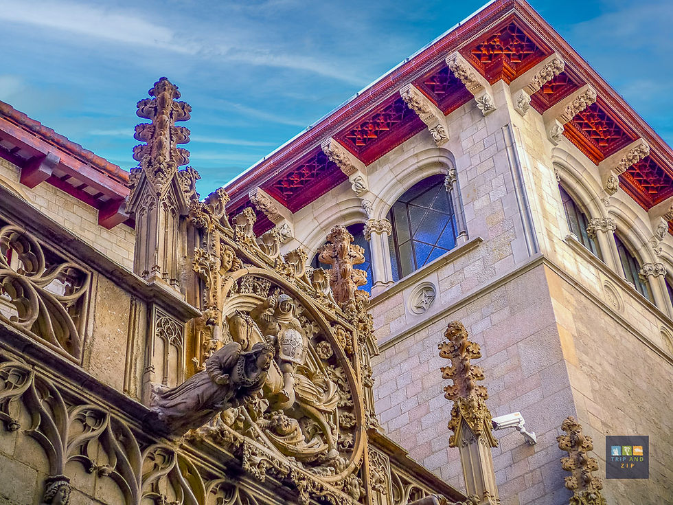 Ornate Gothic facade with detailed carvings on a corner building, featuring arched windows. Vibrant sky background with intricate designs.