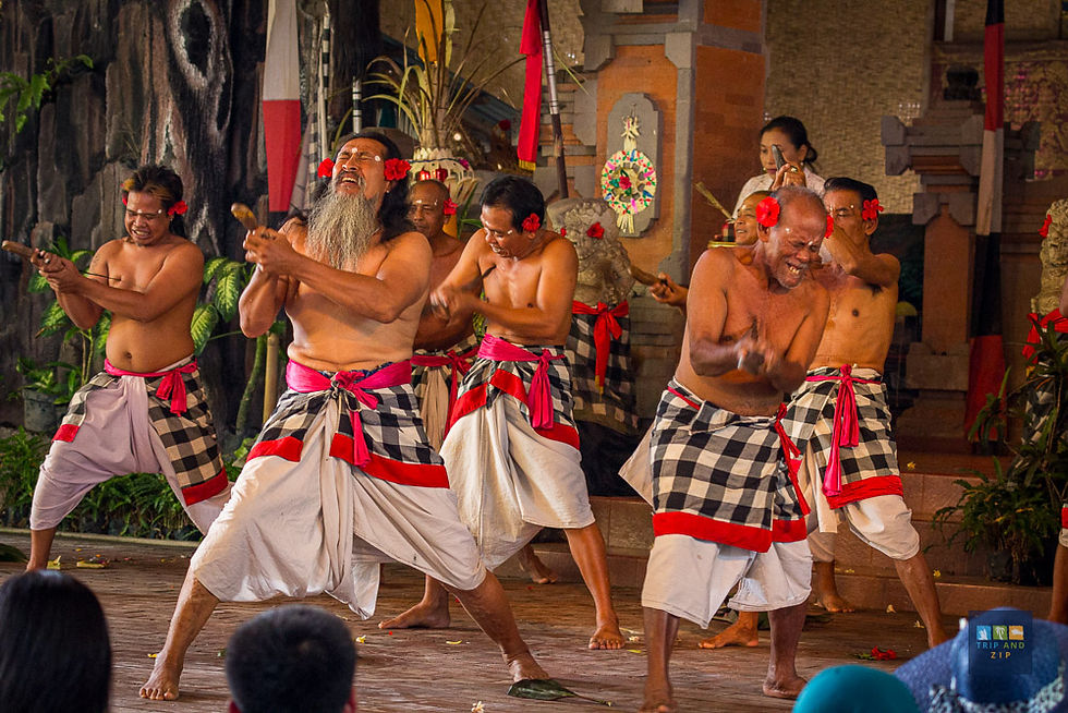 Men perform a traditional Balinese dance wearing white and black plaid sarongs with red sashes, in a vibrant, decorated temple setting.
