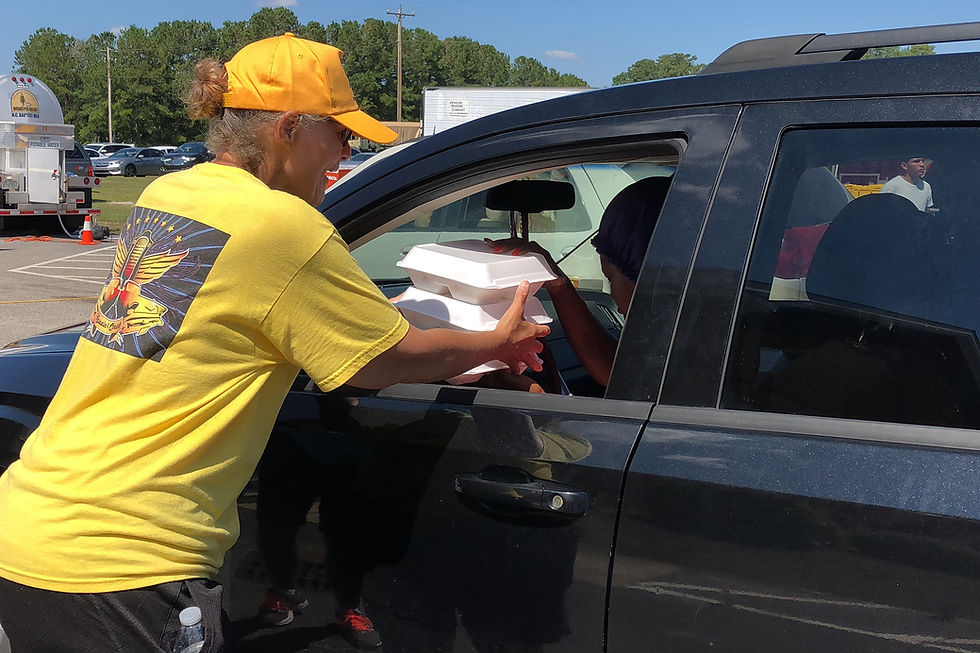 A Southern Baptist Disaster Relief team with the North Carolina Baptists on Mission provides hot meals for a resident in Lumberton, N.C., impacted by Hurricane Florence. (Photo by Brandon Elrod)
