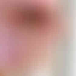 Hand holding ceramic earrings with colorful floral design, Making Ceramic Jewelry, Studio 2