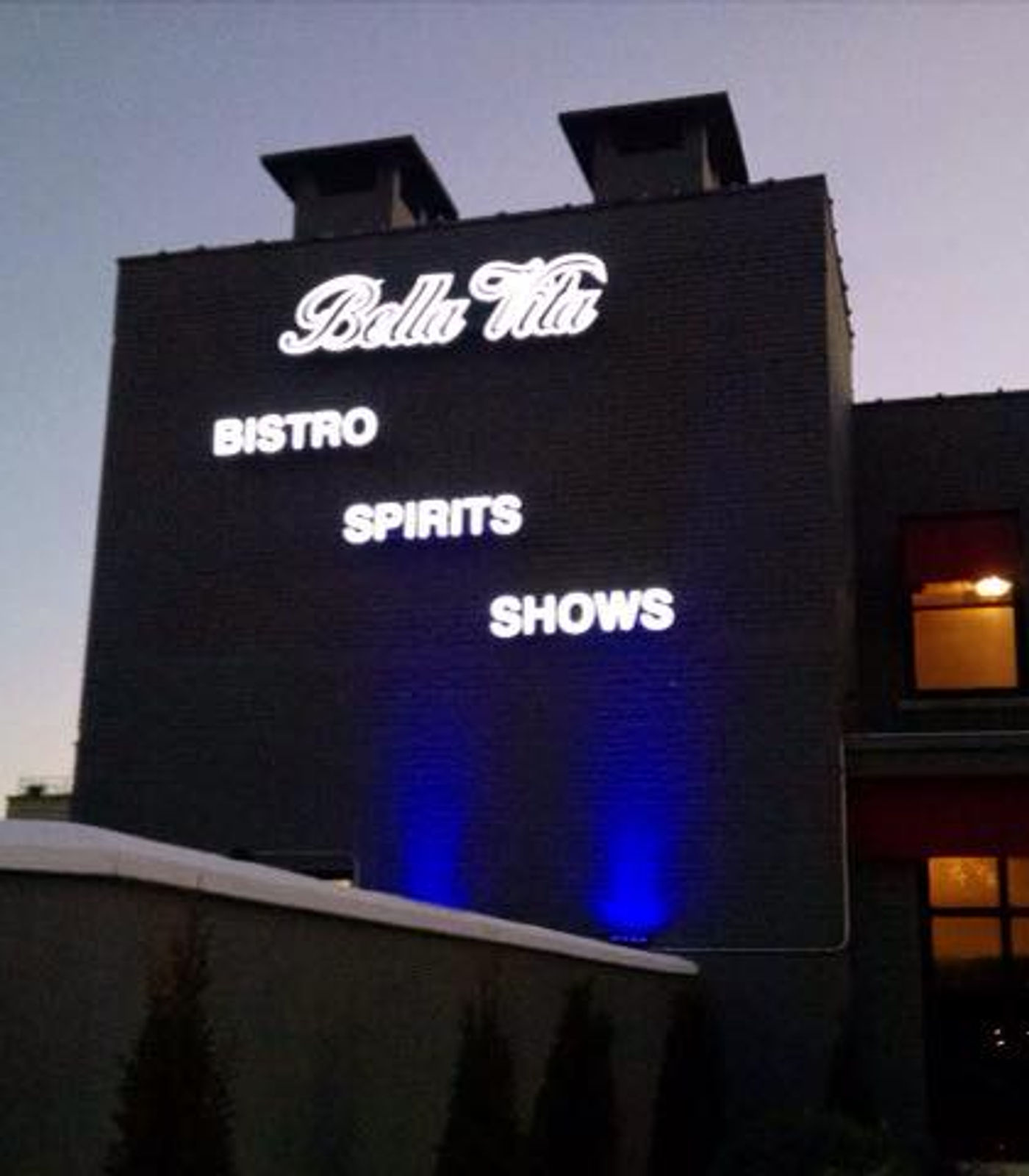 Bella Vita channel letters lit at dusk