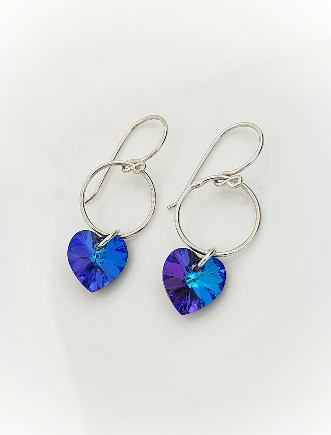 Aretes Corazones en Cristal Morado