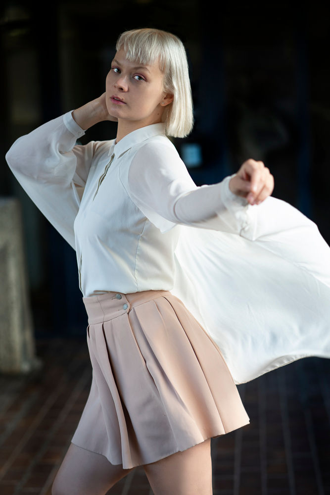 beautiful Portrait photography of a beautiful woman with blond hair and pink skirt