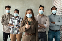 multicultural-businesspeople-in-masks-standing-in-2021-09-02-21-29-07-utc.jpg
