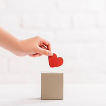cropped-view-of-female-hand-putting-red-heart-in-b-2021-09-01-03-27-08-utc (1).jpg