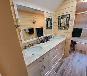 “New his and hers vanity with modern floor tiles and fresh paint in remodeled Connecticut bathroom”