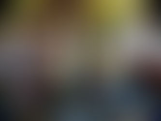 In a cafe nestled amidst trees and plants, on a glass table lies a frappe, a pair of black sunglasses and a copy of Malcolm Gladwell's David and Goliath. Photo by Ninay Desai.