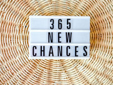 '365 New Chances 'spelt out on a LED light box on a background of woven cane circles. In the context of this post, the image refers to each day being a fresh opportunity to start something new. Image by Kuu Lotus.