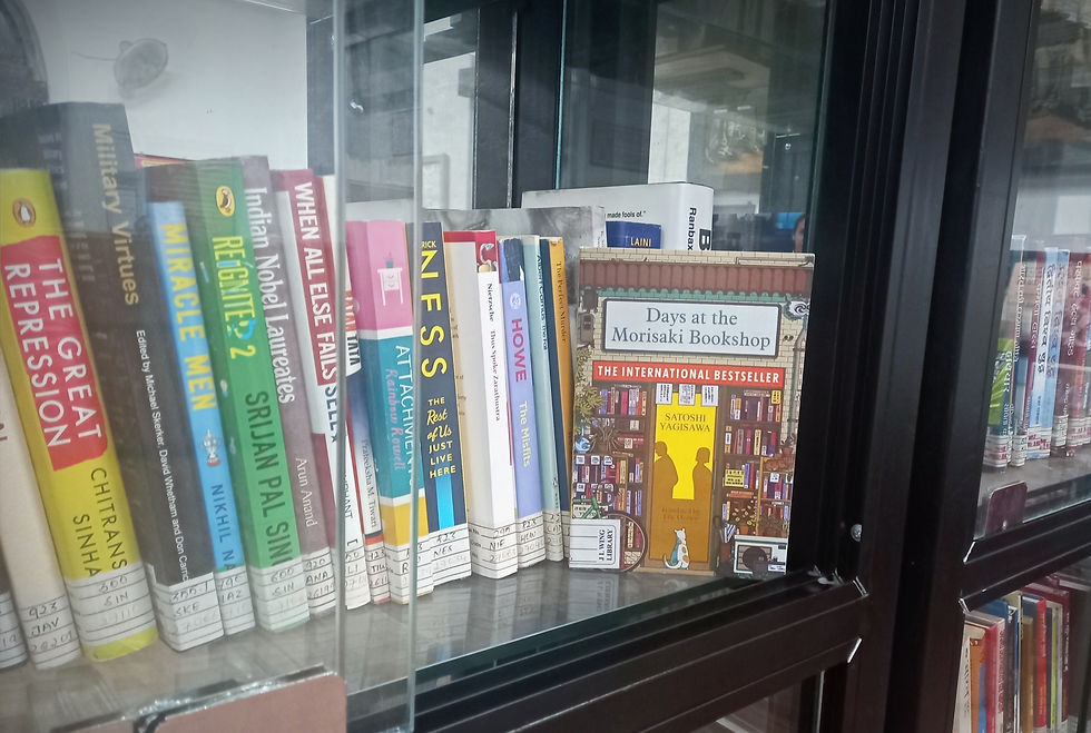 A copy of Satoshi Yagisawa's international bestseller Days at the Morisaki Bookshop stands upright in a bookshelf. Photo by Ninay Desai.