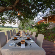 Dulini-River-dining-under-the-sausage-tree-Dulini-Private-Game-Reserve
