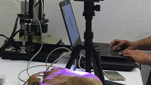 ANCIENT SKULL BEING SCANNED FOR A 3D PRINT