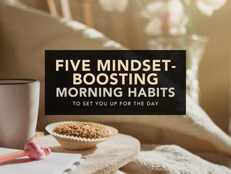 A cup of coffee with a bran muffin next to a pad and pink pen. The scene suggests someone about to undertake five mindset-boosting morning habits to set them up for the day.