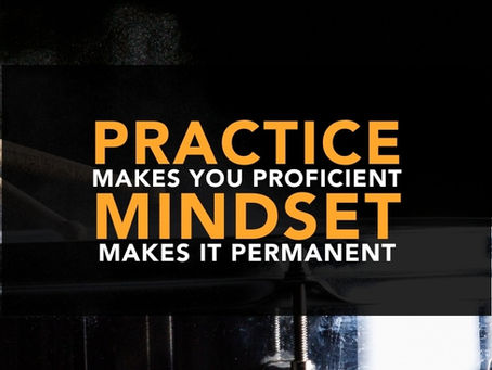 Two weathered drum sticks strike a chrome-shelled snare drum. Chalk dust bounces up from the head. Over the image is a panel of white and orange text that reads "Practice makes you proficient. Mindset makes it permanent."