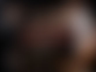 Abstract photo of a conductor leading an orchestra. Over the image is a panel of text that reads, "Do you have a 'Practitioner' or a 'Producer' mindset?"