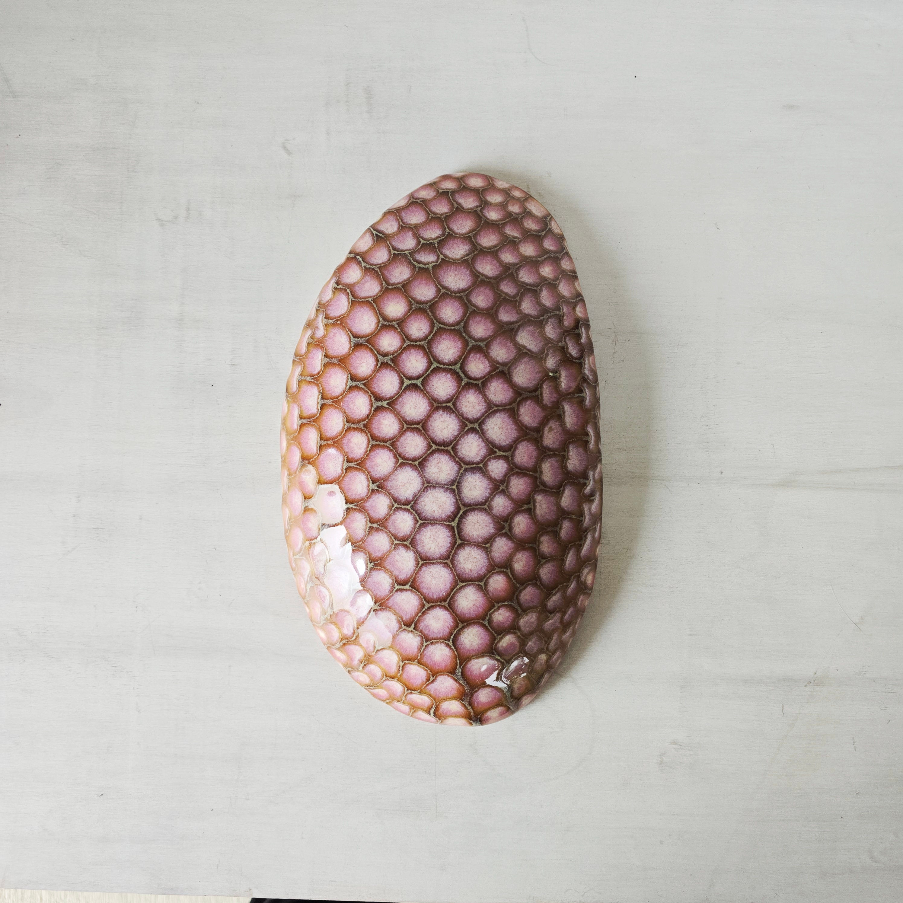 Purple spotted wall hanging.