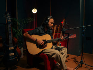 acoustic guitar recording session as part of music production training