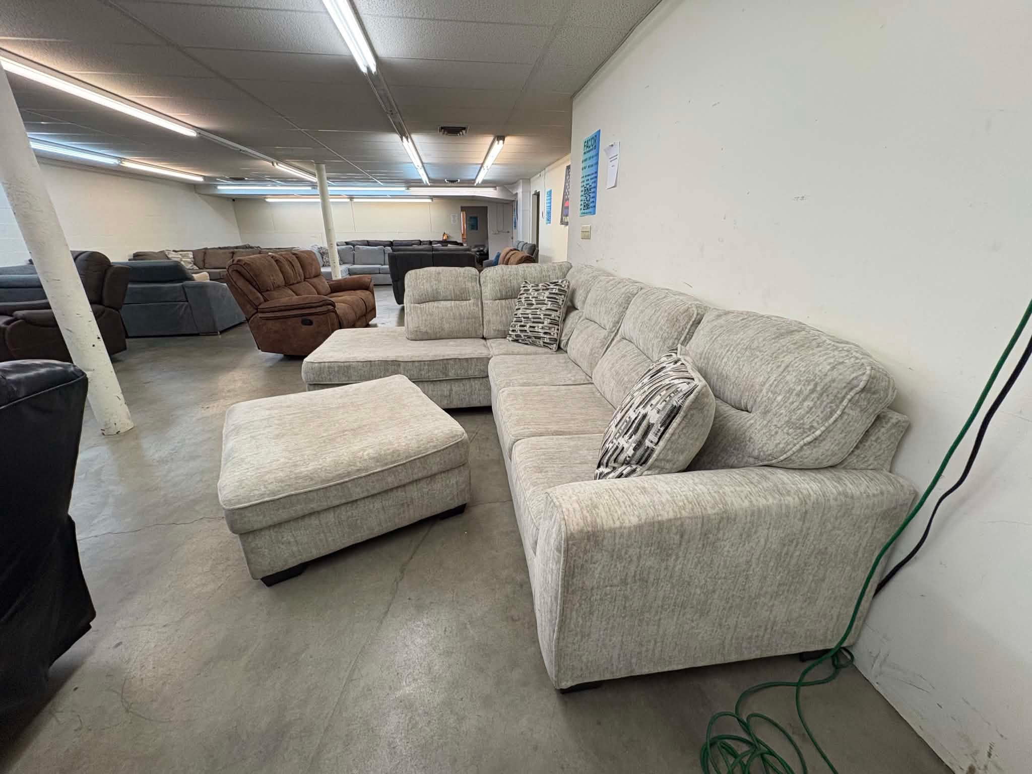 Cream sectional with chaise and ottoman 