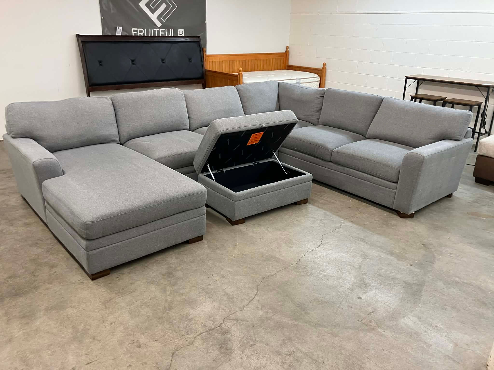 Gray Sectional with Storage Ottoman