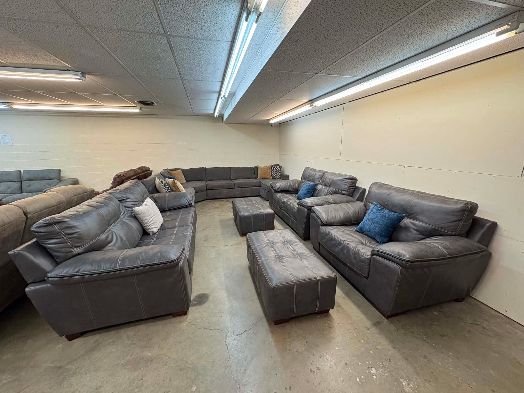 Gray leather couch, loveseat, chair & two ottomans