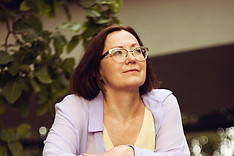 A confident ceo gazes off in the distance after her coaching session