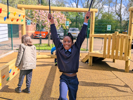 An Oaklands pupil playing on our new play equipment in our playground