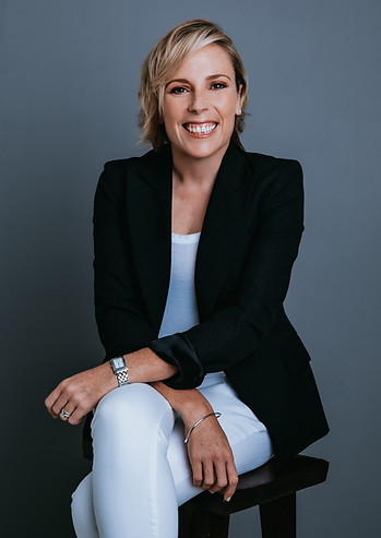 Meet KC, or Kathryn who is smiling, has blond shoulder length hair, wearing white jeans an