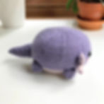Side view of the axolotl toy, showing placement of tail and gills