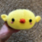 Front view of a chick bun-shaped toy