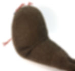 knitted walrus body from the side, showing how the folds have been sewn together across the back.