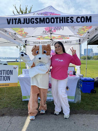 5K mascot stopping by our pop up tent