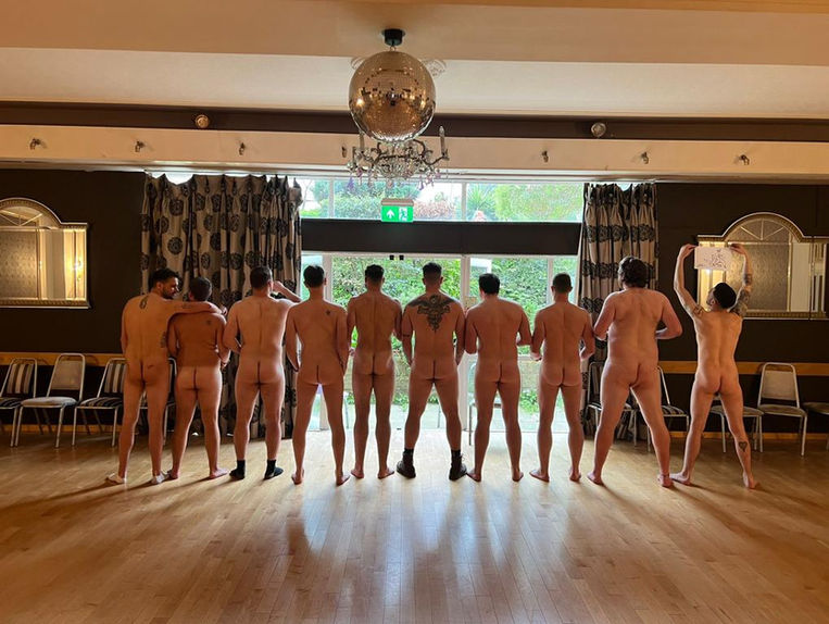 Group of nude males posing from behind for life drawing class
