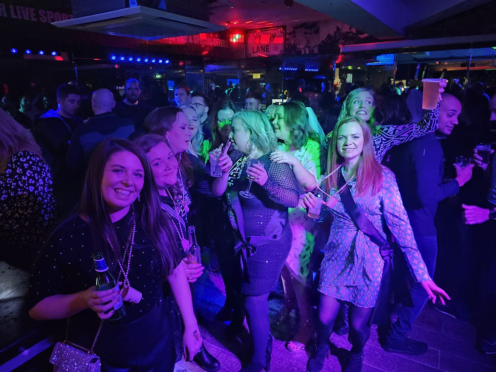 Group enjoying a hen party activity such as dance class or cocktail experience.