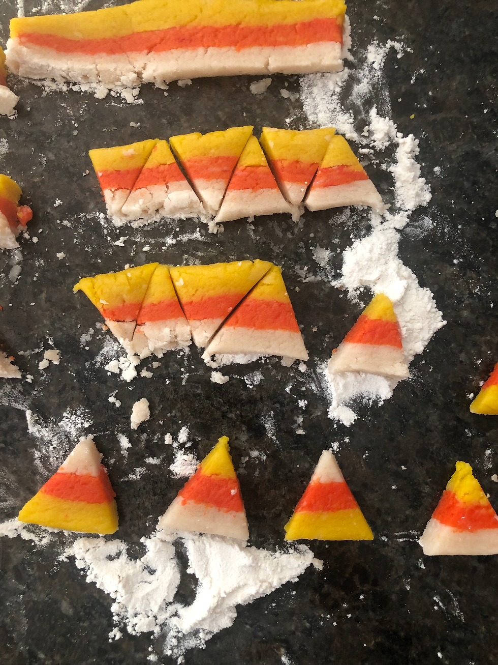 A progress picture - the top strip is uncut, while the two middle strips are cut into triangles. The bottom strip is cut into triangles and equally spread out.