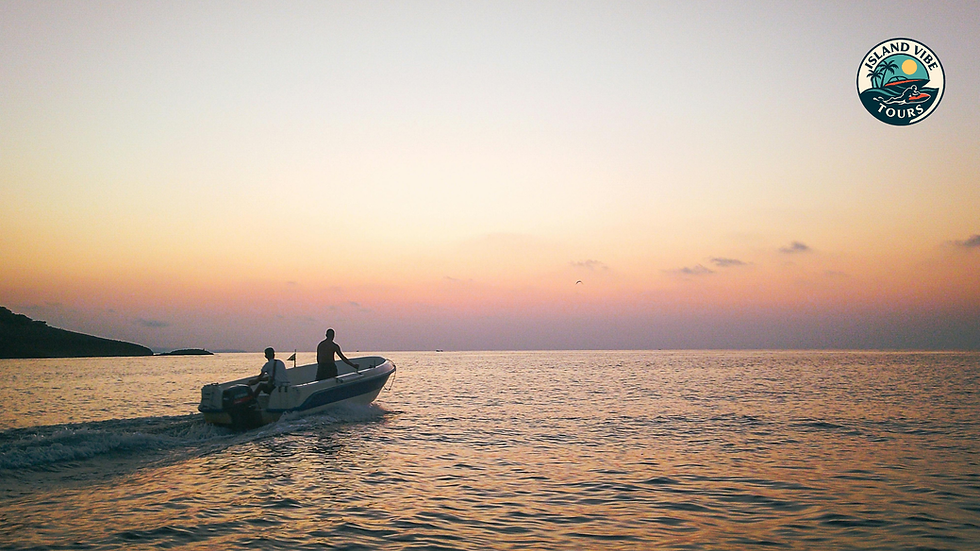 Boat cruising toward Klein Curaçao during a beautiful Caribbean sunset