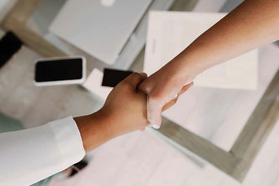 Small business team reviewing ISO compliance documents and tender applications.