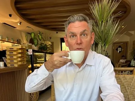 Mark Edgington drinking a cup of decaf coffee in Podgorica, Montenegro