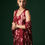 Thumbnail: Deep red Calendula mulberry silk draped dress paired with cape