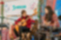 Music teacher with student learning to play the guitar