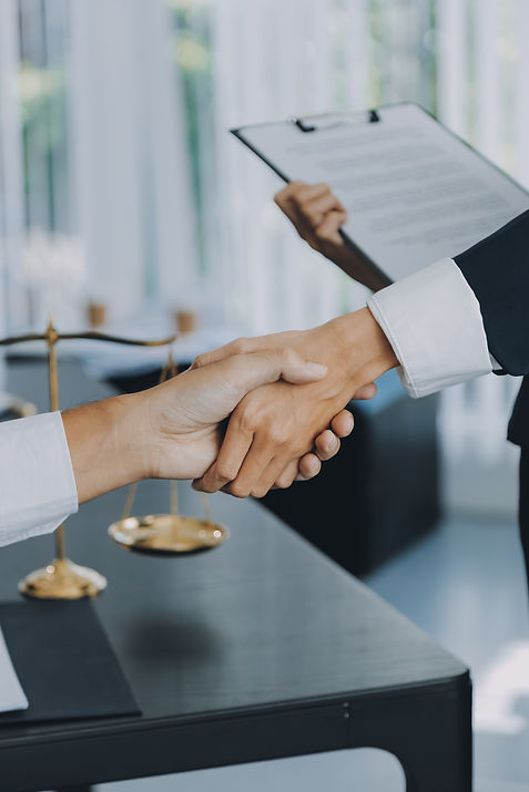 businessman-shaking-hands-seal-deal-with-his-partner-lawyers-attorneys-discussing-contract