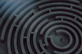 confused-businessman-thinks-how-find-right-way-exit-from-big-maze_edited.jpg
