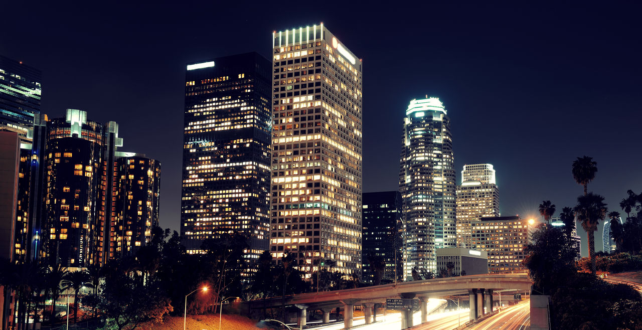 los-angeles-downtown-night-with-urban-buildings-light-trail.jpg