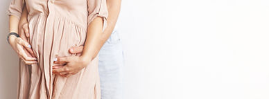young-pregnant-woman-husband-hugging-her-belly-close-banner.jpg